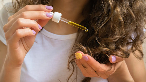 Photo of a girl using a product for her curly hair